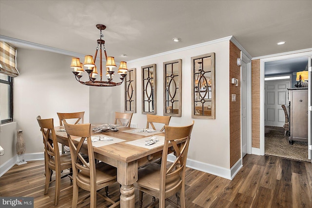 dining room with crown molding, baseboards, dark wood-style flooring, and a chandelier