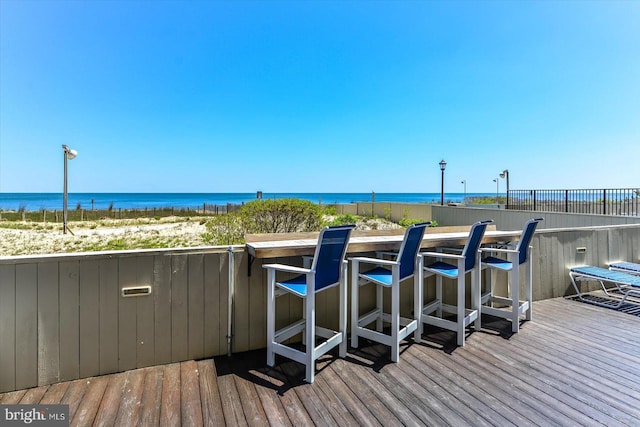 wooden terrace with a water view