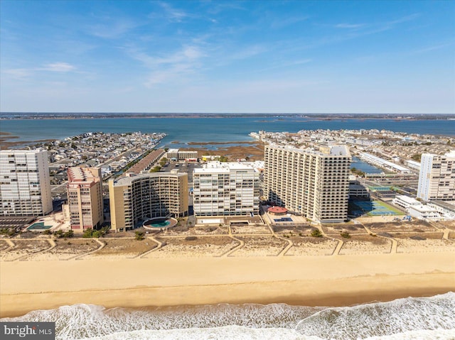 bird's eye view featuring a city view, a beach view, and a water view