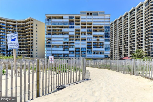 view of building exterior with fence