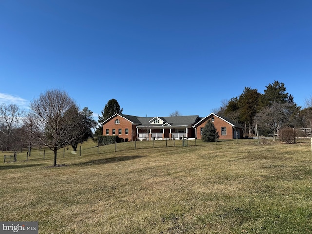 view of front facade featuring fence