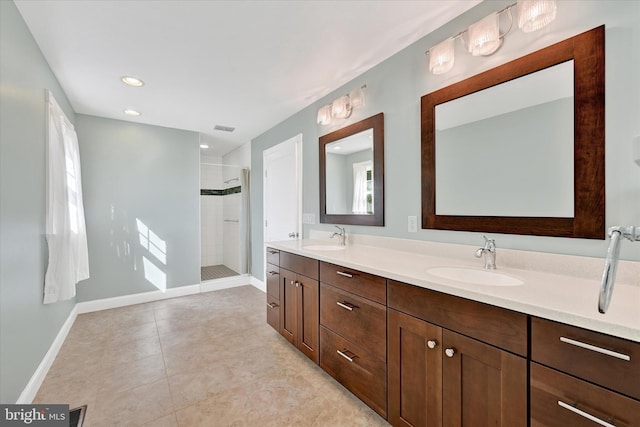 bathroom featuring a sink, visible vents, a stall shower, and double vanity