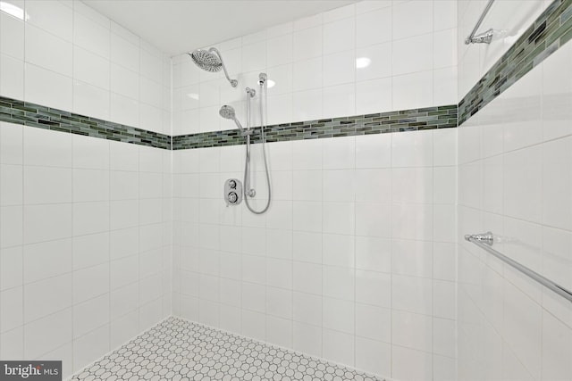 full bath with a tile shower