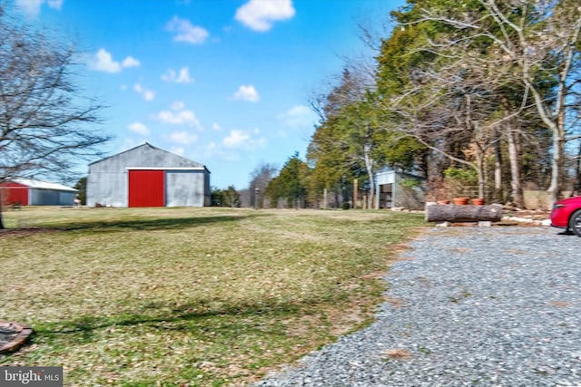 view of yard with an outbuilding and an outdoor structure