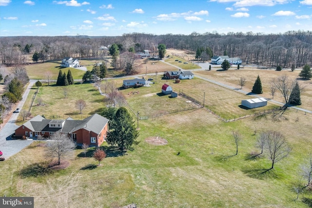 aerial view with a rural view and a wooded view