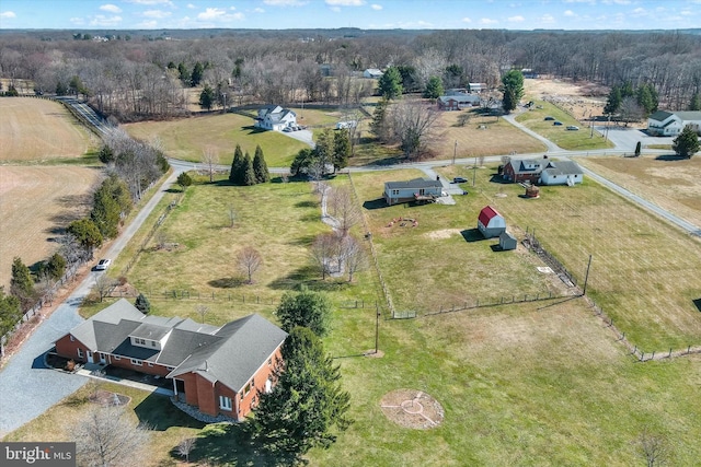 birds eye view of property with a rural view