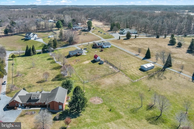 drone / aerial view with a rural view and a view of trees