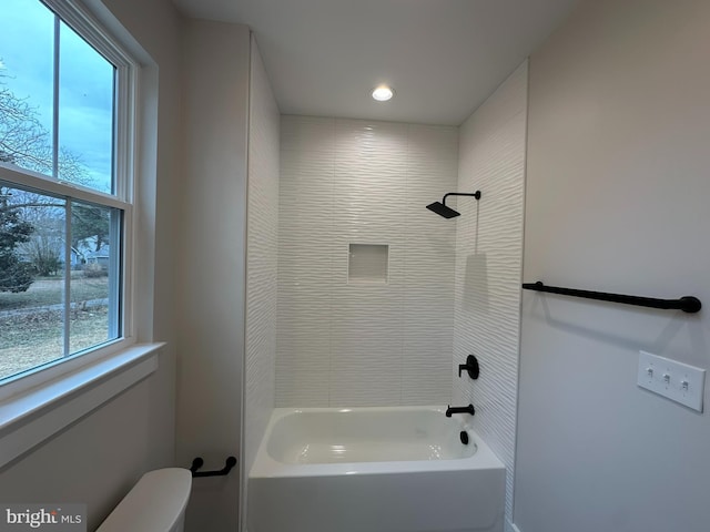 full bathroom featuring tub / shower combination and toilet