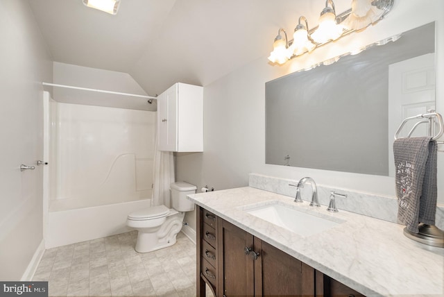 bathroom with toilet, vanity, baseboards, vaulted ceiling, and tub / shower combination