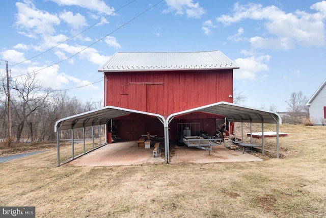 view of outbuilding with a carport and an outdoor structure