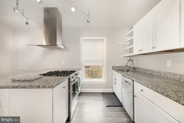 kitchen featuring light stone countertops, appliances with stainless steel finishes, island range hood, and white cabinets