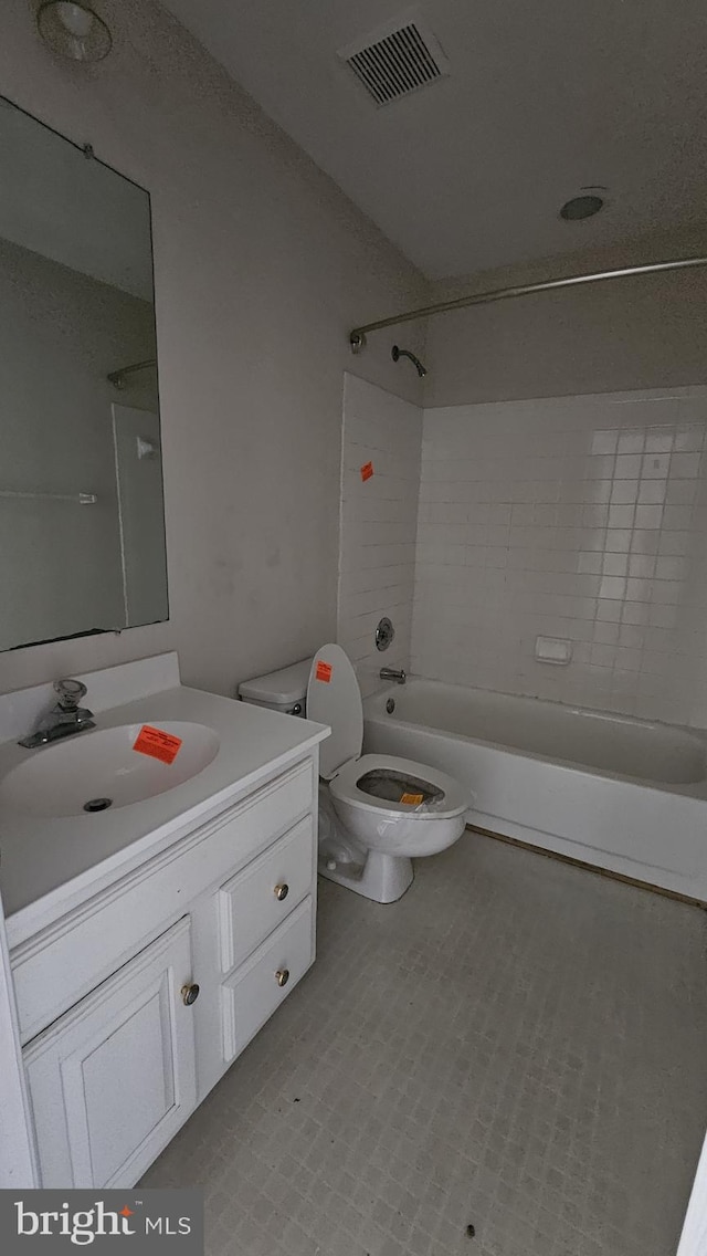 bathroom featuring visible vents, shower / bathing tub combination, vanity, and toilet