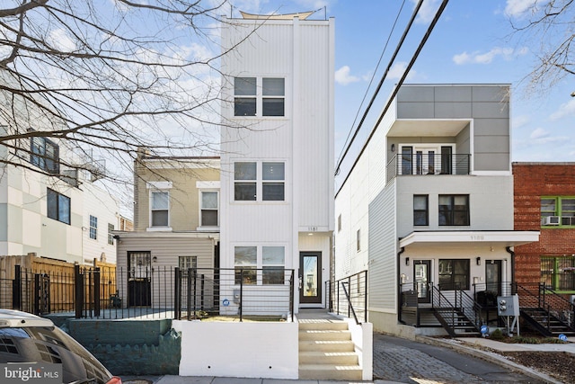 multi unit property featuring a fenced front yard