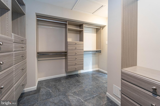 spacious closet featuring visible vents