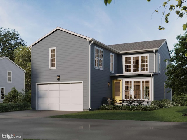 traditional-style home with driveway, a front lawn, and an attached garage