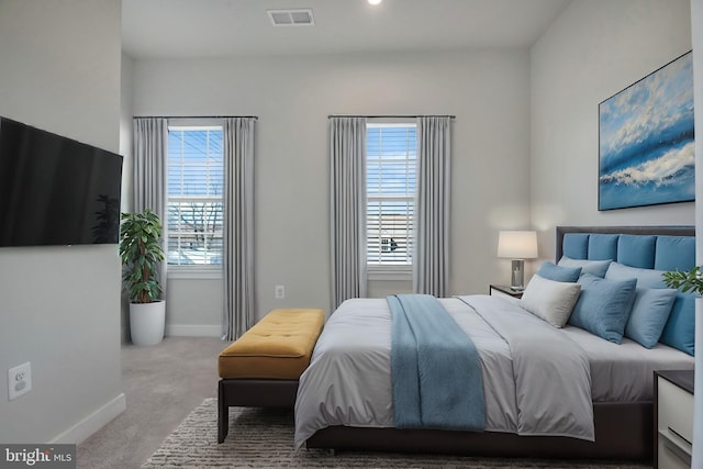 bedroom featuring visible vents, baseboards, and carpet floors