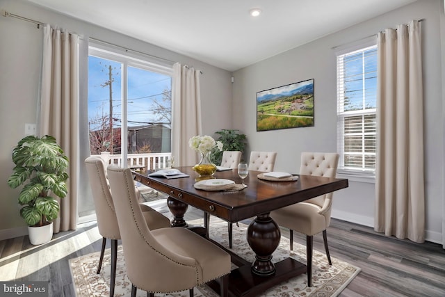 dining area featuring wood finished floors and baseboards