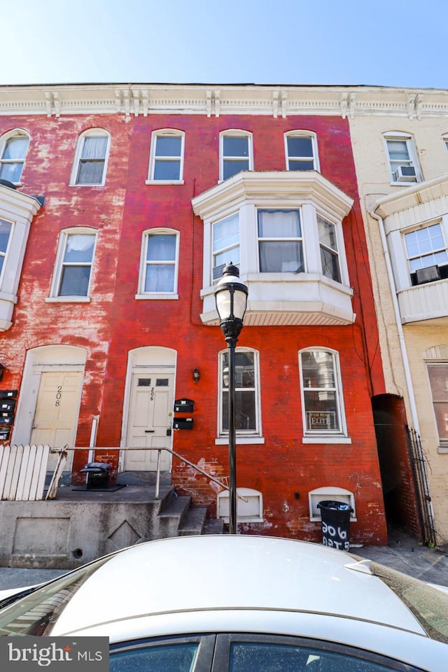 townhome / multi-family property featuring brick siding