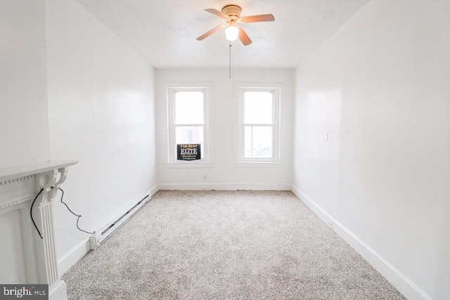 empty room featuring ceiling fan, a baseboard radiator, carpet flooring, and baseboards