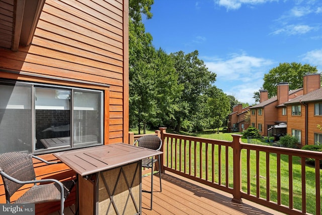 wooden terrace with a yard