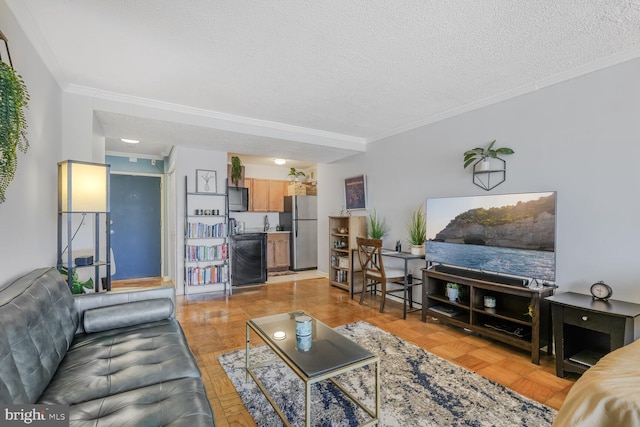 living room featuring ornamental molding and a textured ceiling