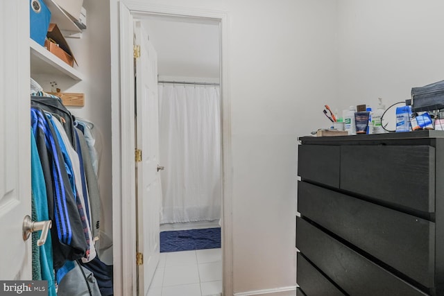 spacious closet featuring tile patterned flooring