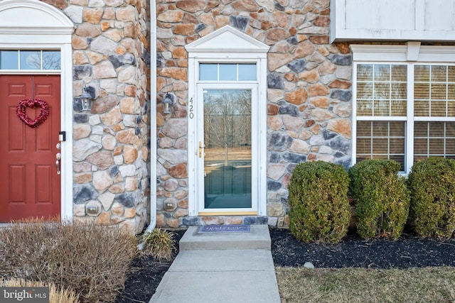 entrance to property with stone siding