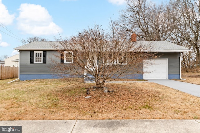 ranch-style house featuring a garage, driveway, a chimney, fence, and a front lawn