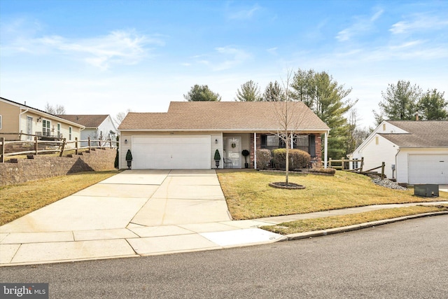 view of front of property featuring a front yard, an attached garage, fence, and driveway