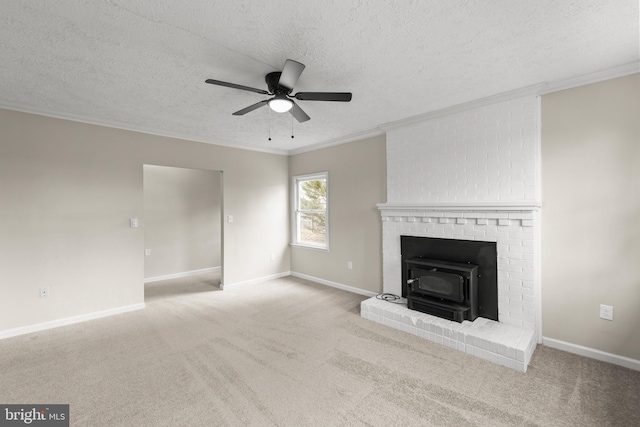 unfurnished living room featuring carpet floors, crown molding, baseboards, and ceiling fan