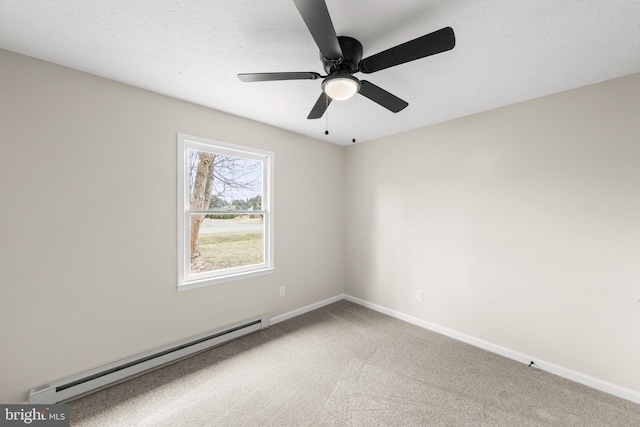 spare room featuring a textured ceiling, a baseboard heating unit, light carpet, a ceiling fan, and baseboards