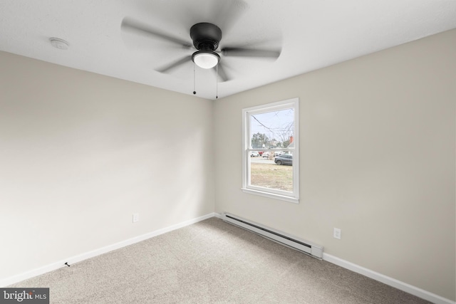 carpeted empty room with a baseboard radiator, baseboards, and a ceiling fan