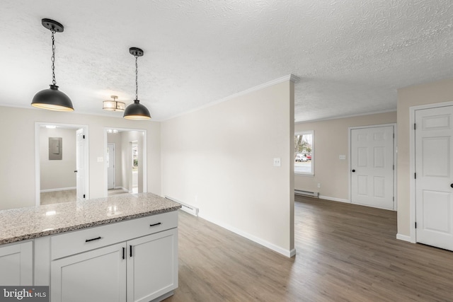 kitchen with hanging light fixtures, light wood-style flooring, a baseboard heating unit, white cabinetry, and a textured ceiling