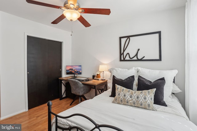 bedroom featuring ceiling fan and wood finished floors