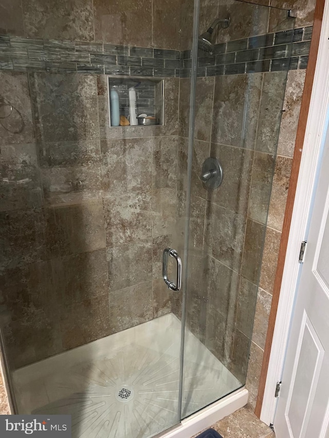 bathroom featuring a shower stall