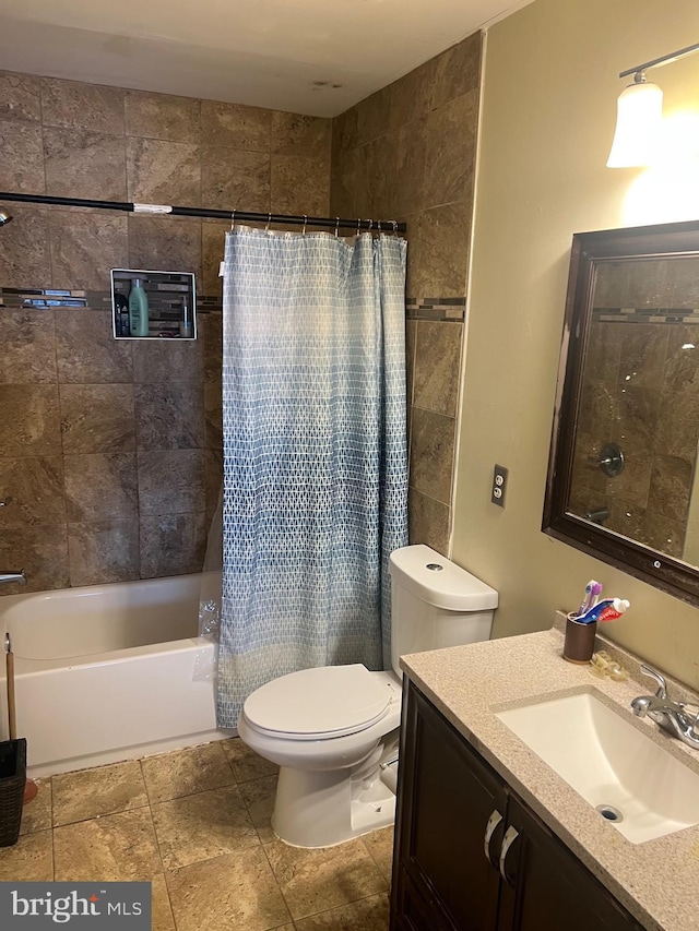 bathroom with toilet, shower / tub combo, and vanity