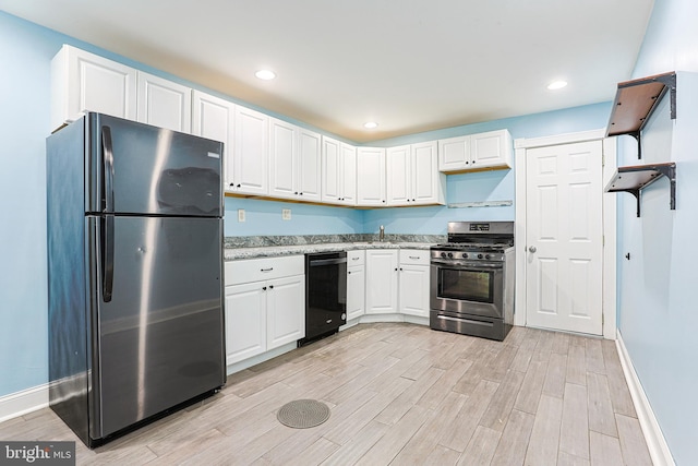 kitchen featuring white cabinetry, wood tiled floor, appliances with stainless steel finishes, and recessed lighting