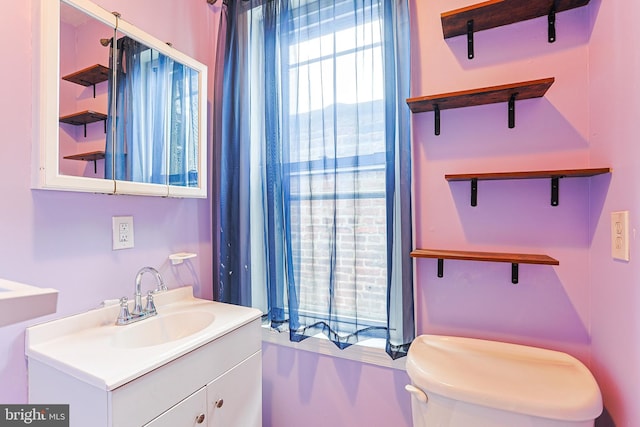 half bathroom featuring vanity