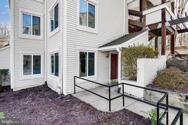 entrance to property featuring a patio