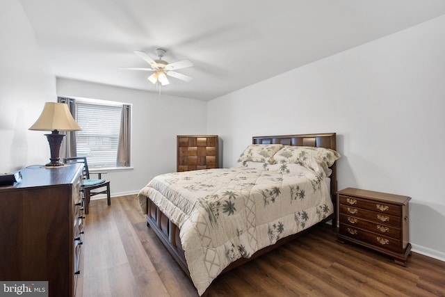 bedroom with wood finished floors and baseboards