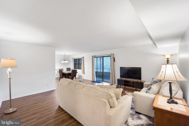 living area featuring dark wood-style floors and baseboards