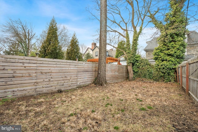 view of yard with a fenced backyard