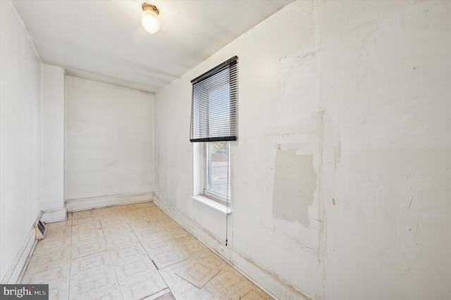 empty room featuring tile patterned floors