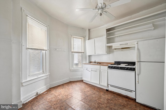 kitchen with white appliances, baseboards, open shelves, a sink, and white cabinets