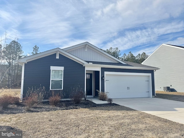 ranch-style house with driveway, a garage, and board and batten siding