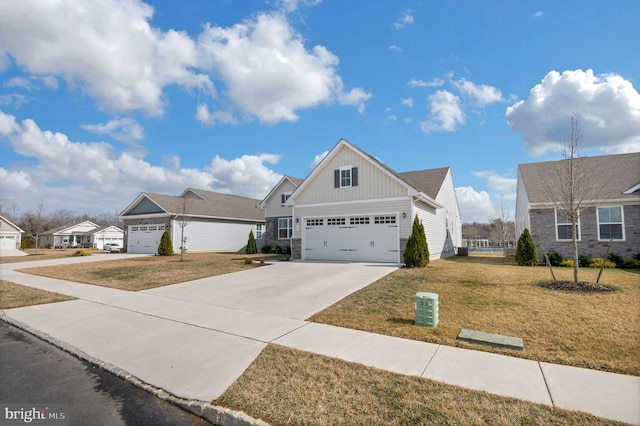 view of front of property with board and batten siding, concrete driveway, stone siding, and a front lawn