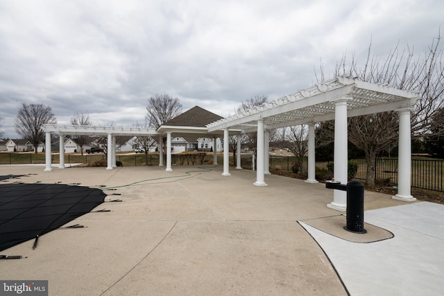 view of patio / terrace featuring fence and a pergola