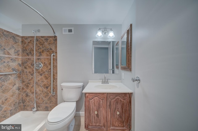 bathroom with toilet, visible vents, and tiled shower