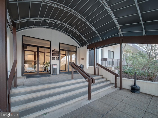 doorway to property with french doors and stucco siding