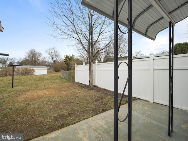 view of yard with a patio area and a fenced backyard